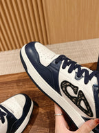 Close-up of navy and white sneaker with textured side emblem