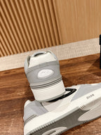 Dior unisex sneakers rear view: white midsole with gray heel tab, lace-up pair