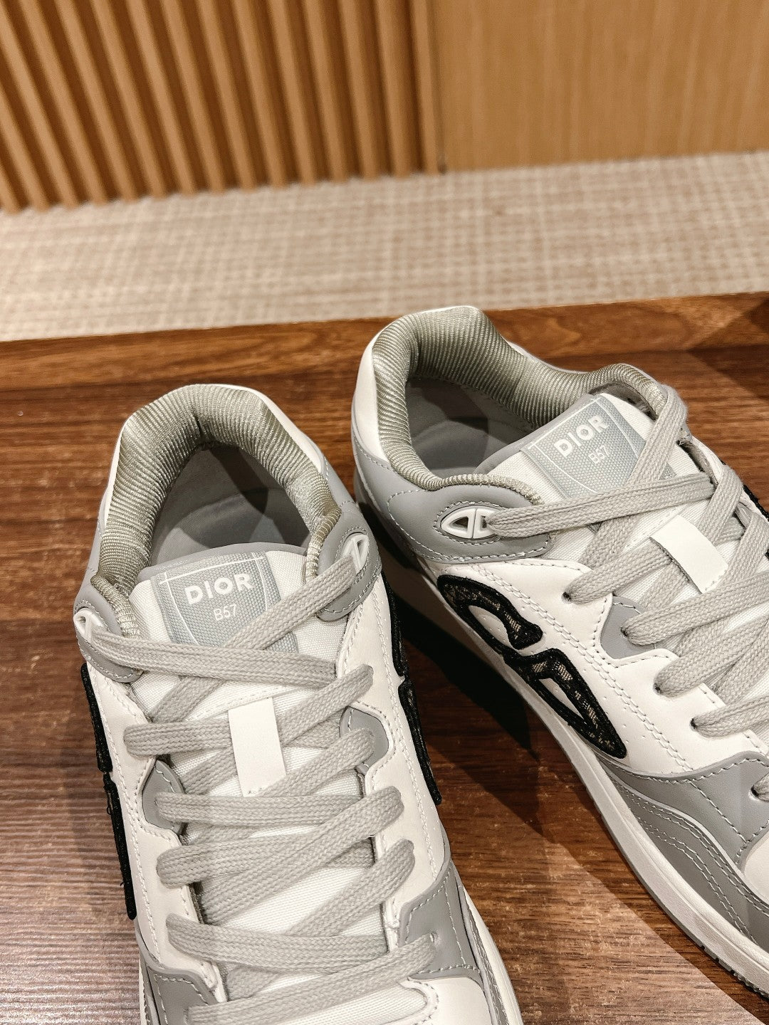 Dior unisex sneakers, white with gray collars and side black logo, lace-up design