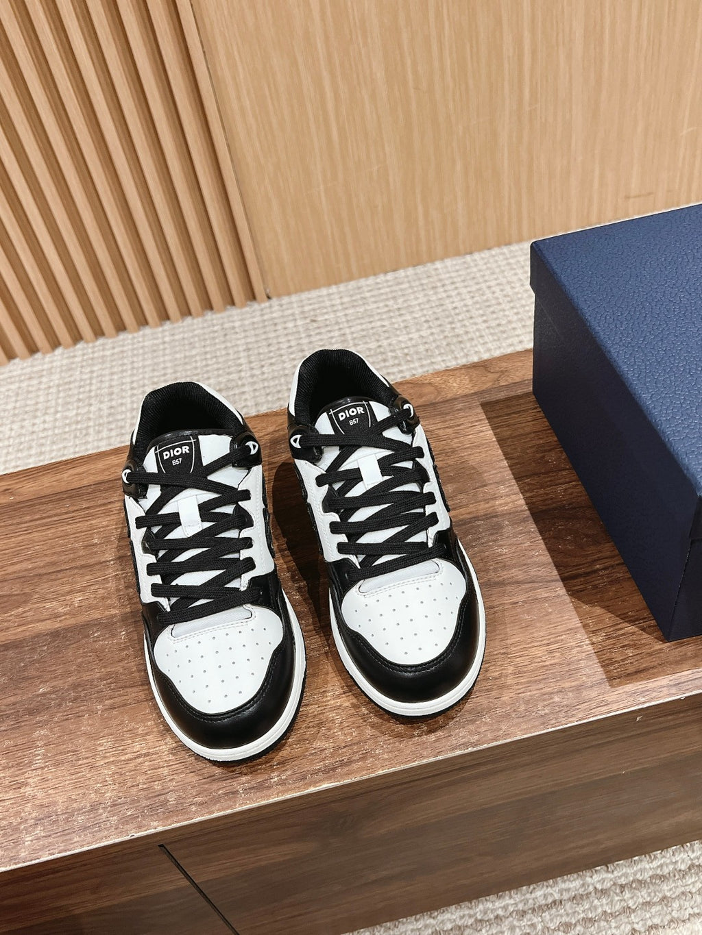 Dior unisex low-top sneakers in black and white with lace-up design and chunky sole
