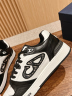 Black and white Dior lace-up sneakers with textured side panel and white midsole