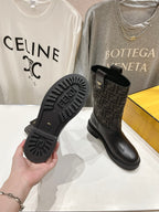 Fendi ladies boots outsole view with FF-style tread and black rubber sole