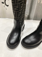 Black Fendi ladies boots, close toe-to-shaft view with FF monogram side panel