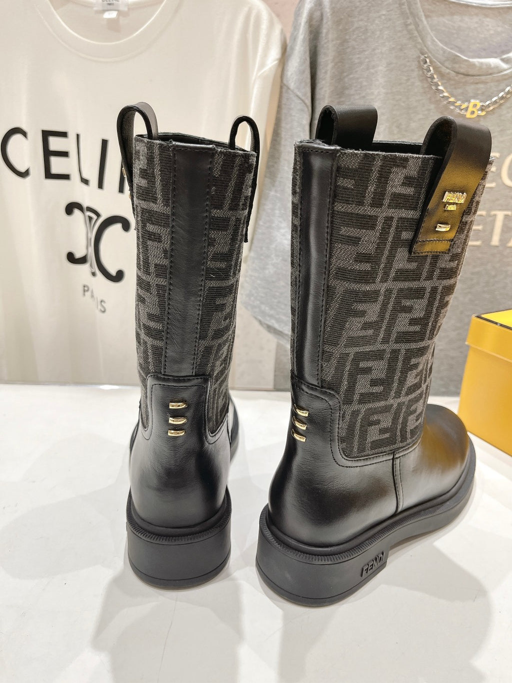 Black Fendi ladies boots, rear view with tall pull tabs and gold-tone hardware