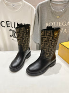 Women’s Fendi FF-logo ankle boots with pull tab and black rubber sole.