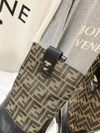Fendi FF-logo boots, black ankle panel with gold-tone stud buckle detail.
