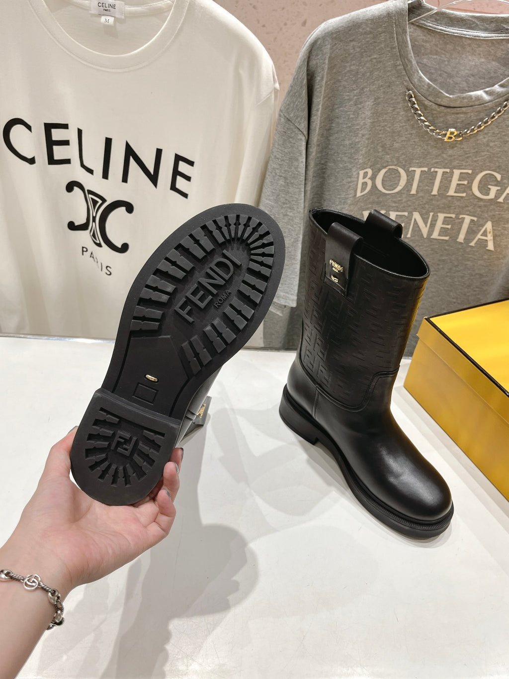 Boot sole with FENDI tread pattern for traction, black mid-calf pull-on boots