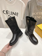 Fendi women’s leather boots, black, mid-calf height with buckle strap detail.