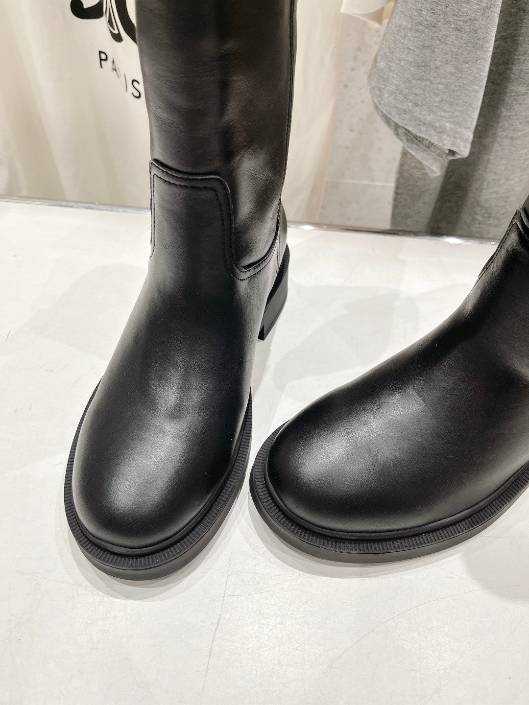 Fendi women’s leather boots, black, close-up of lower shafts and round toe.