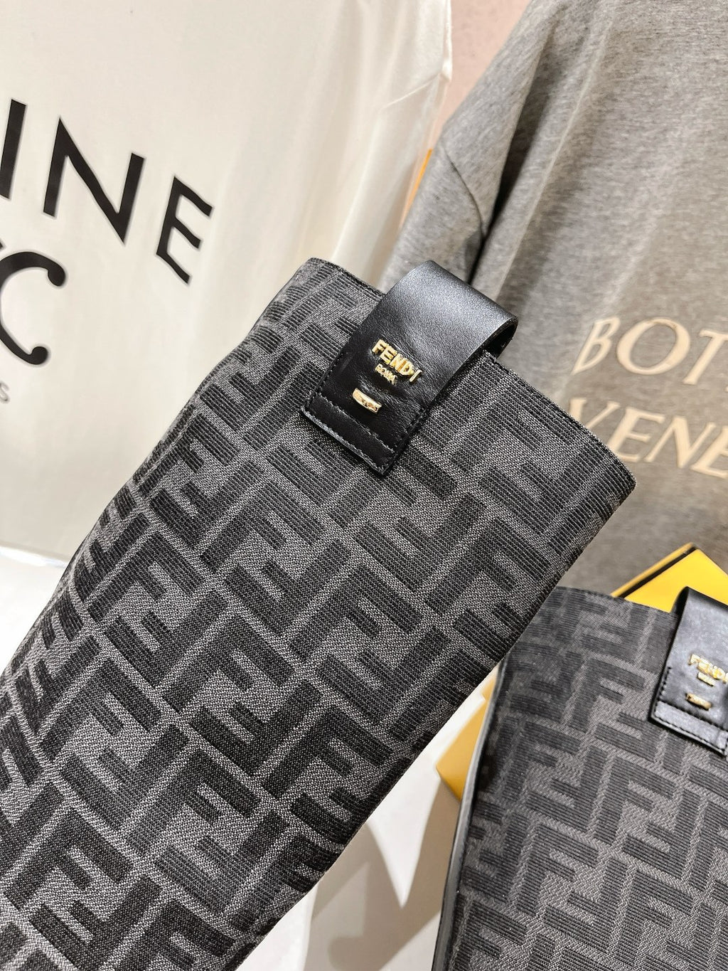 Fendi monogram tall boot shaft detail, gray-black woven pattern with logo patch