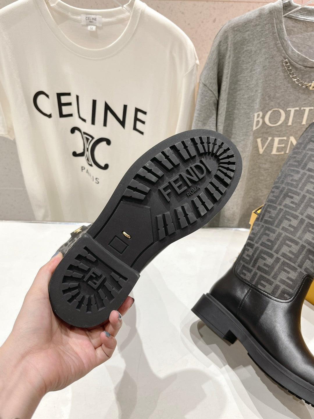 Fendi boots outsole tread close-up, black rubber sole with star-like grip