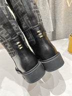 Fendi logo boots heel close-up, black leather with contrast monogram panels
