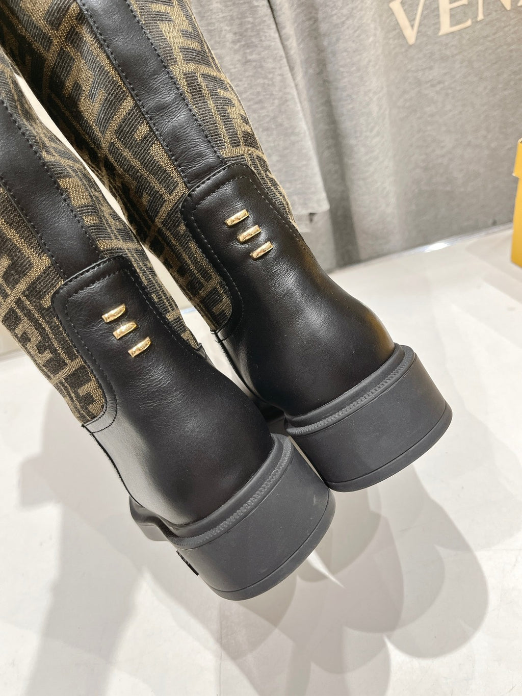 Fendi FF monogram tall boots side view with gold eyelets and cushioned sole