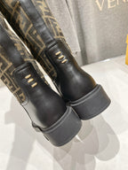 Fendi FF monogram tall boots side view with gold eyelets and cushioned sole