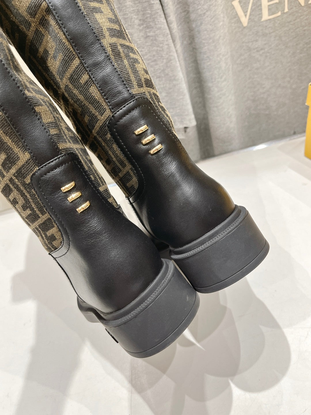 Fendi FF monogram tall boots side view with gold eyelets and cushioned sole