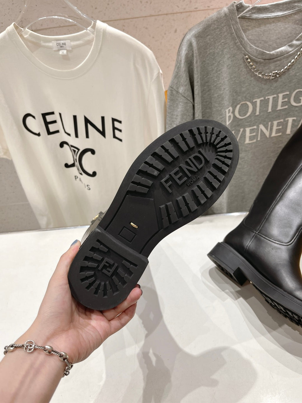 Black boot outsole with FENDI text and deep tread pattern
