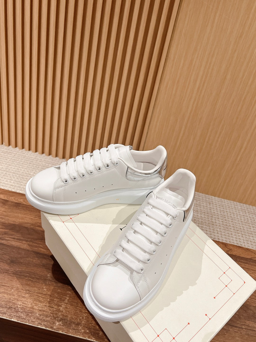 White leather lace-up sneakers with logo patch and cupsole sole