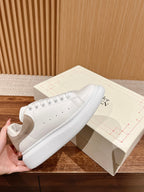 Alexander McQueen white leather sneakers with beige suede panels and lace-up design