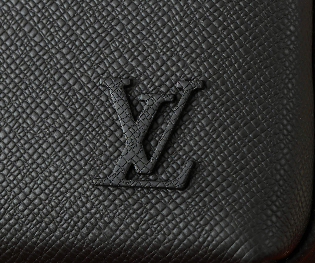 Black textured leather panel with Louis Vuitton monogram emboss