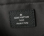 Black leather bag interior label reading 'LOUIS VUITTON PARIS made in italy'.