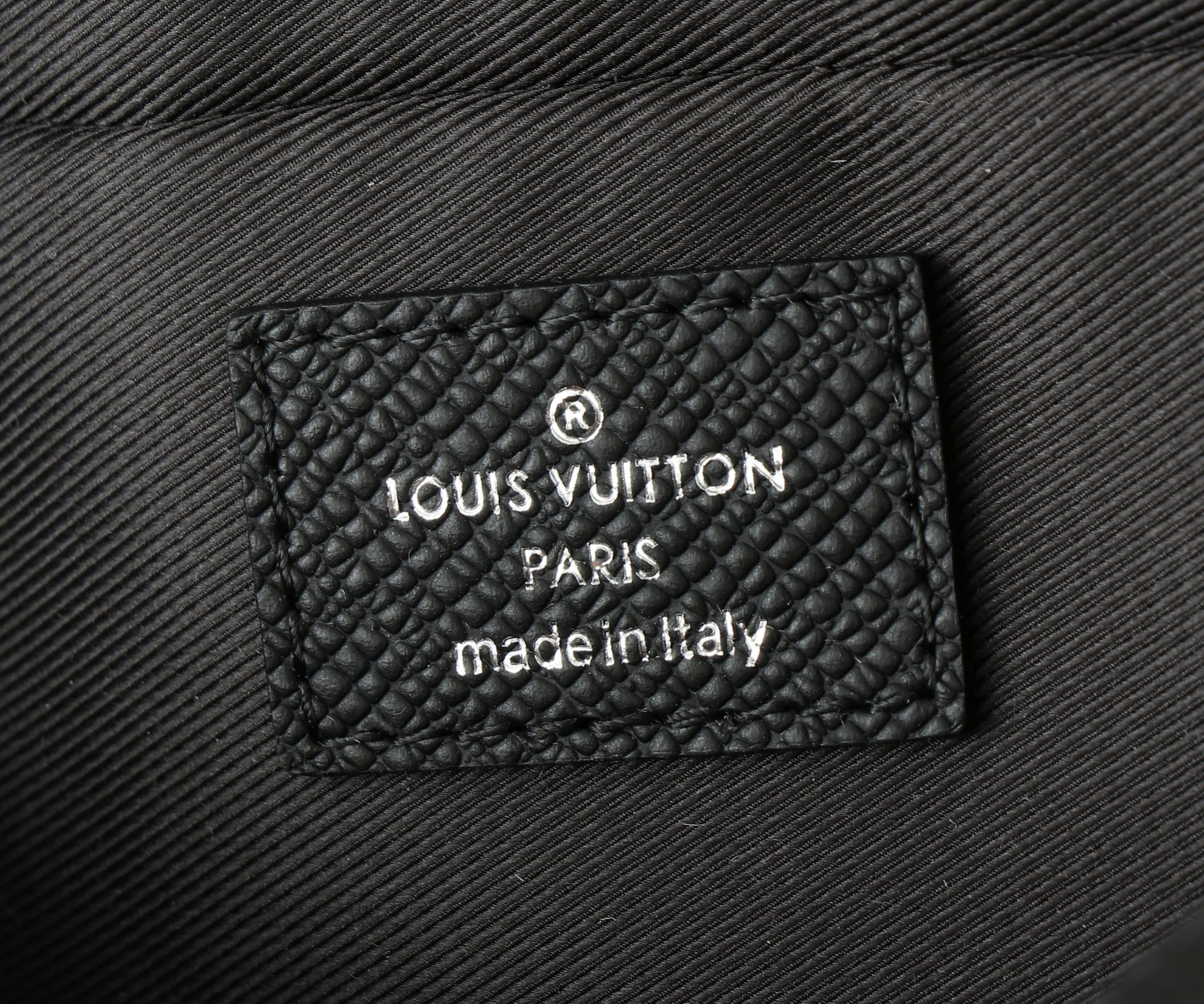 Black leather brand label reading 'LOUIS VUITTON PARIS' and 'made in Italy'