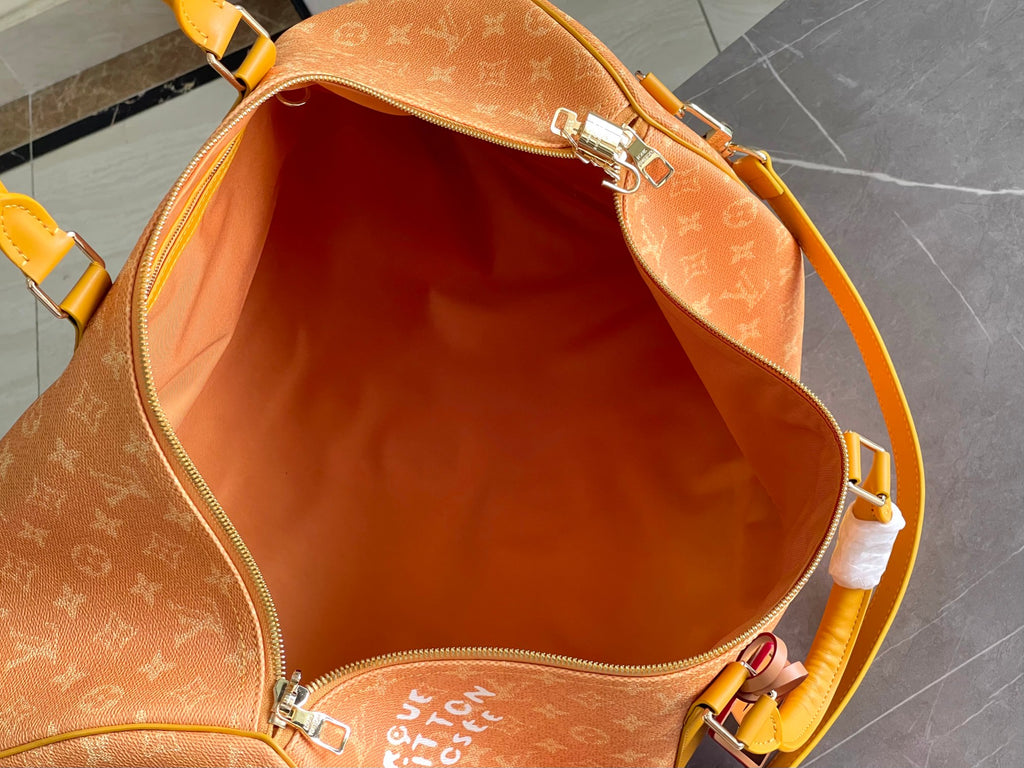 Monogram duffel bag interior with orange lining and zip closure, top open
