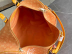 Monogram duffel bag interior with orange lining and zip closure, top open