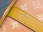 Yellow leather tab with Louis Vuitton logo and edge stitching on monogram canvas