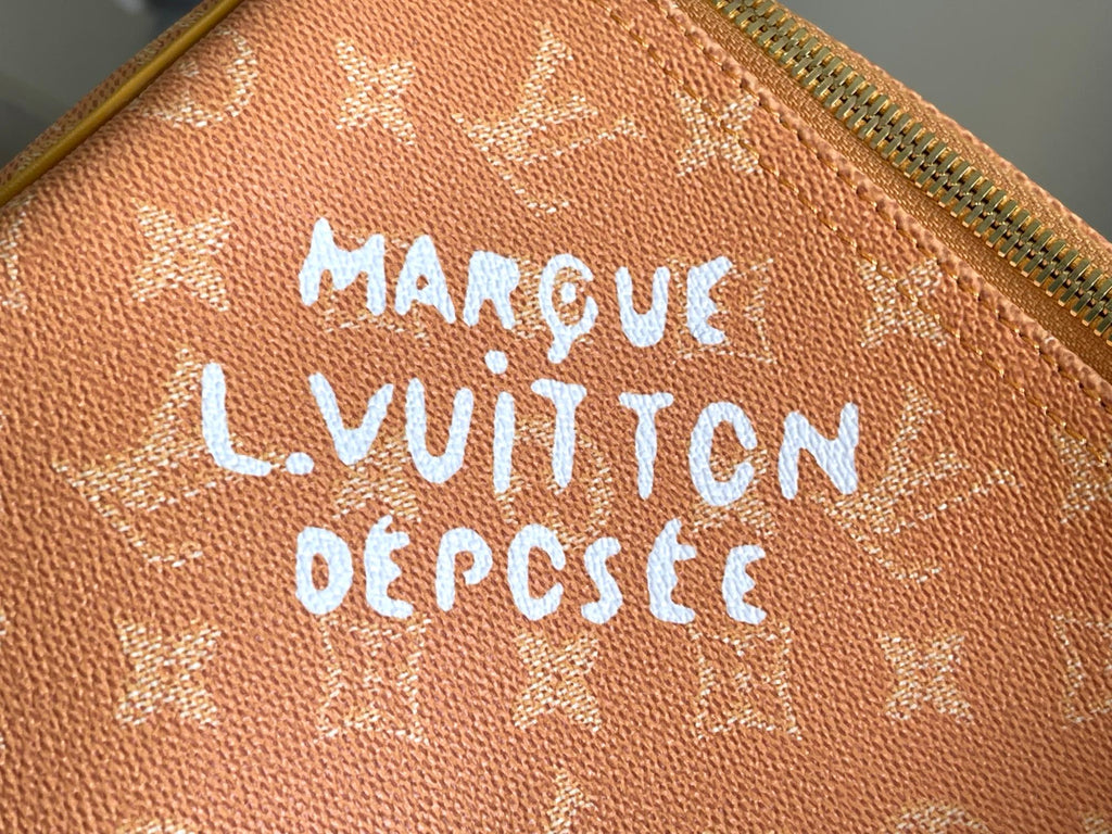 Monogram canvas with embossed trademark lettering and tan stitching
