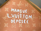 Monogram canvas with embossed trademark lettering and tan stitching