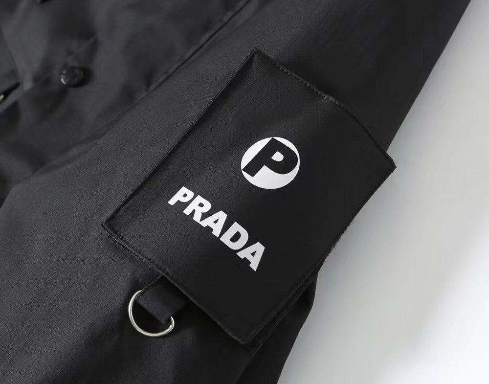 Prada PRADA logo patch with circular emblem on dark jacket sleeve