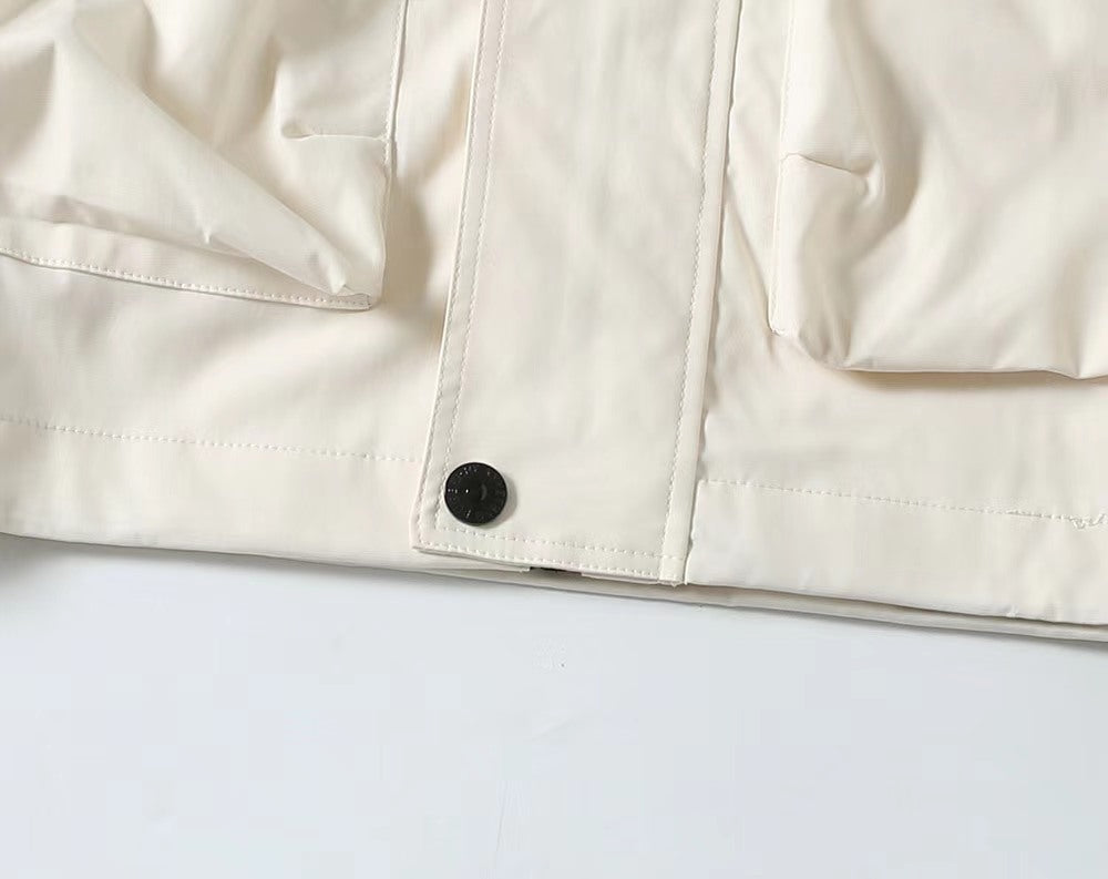Burberry white jacket front with snap closure and stitched panel seams