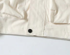 Burberry white jacket front with snap closure and stitched panel seams
