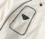 White hooded jacket chest pocket with small triangular PRADA logo patch