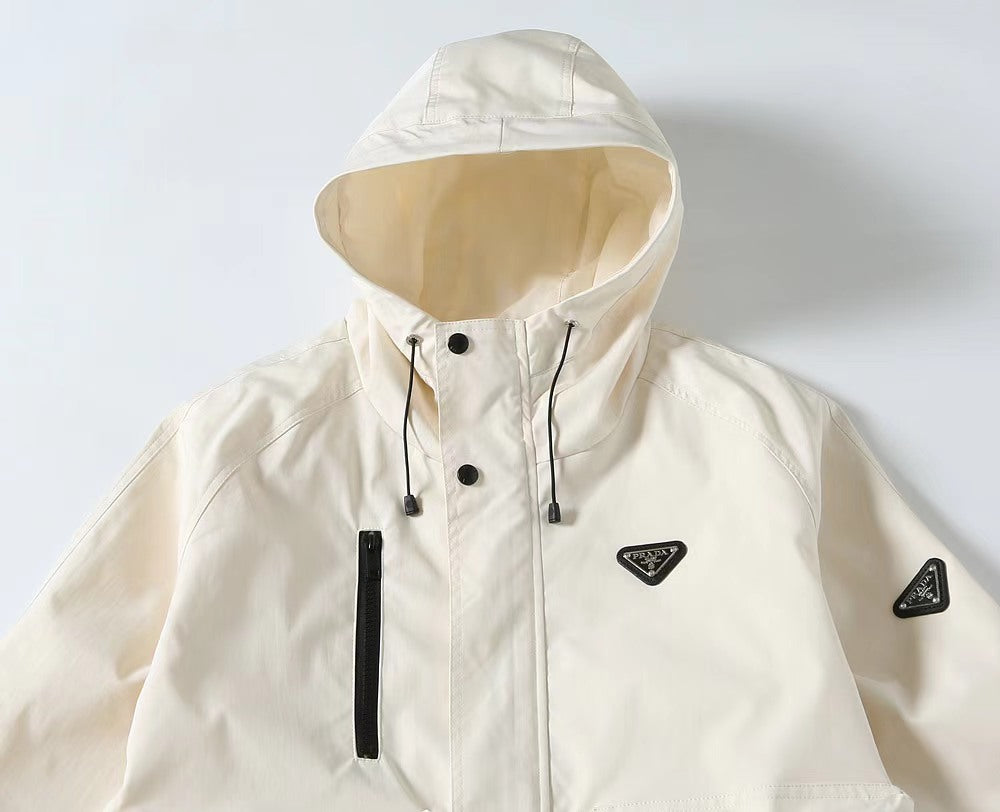 White hooded long jacket with drawstrings, buttons, and Prada triangle logo badge