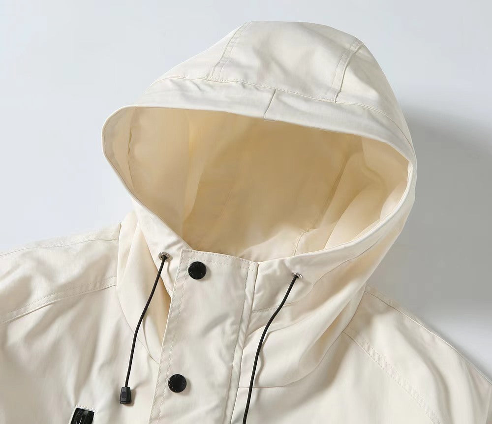 White hooded long jacket close-up with adjustable drawcords under hood