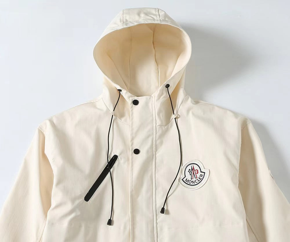 Long hooded Moncler jacket in white with drawstring cords and logo patch