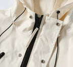 Moncler jacket front detail with zipper, snap buttons, and drawstring cords