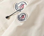 Moncler logo patches on white hooded jacket with black drawstring cords