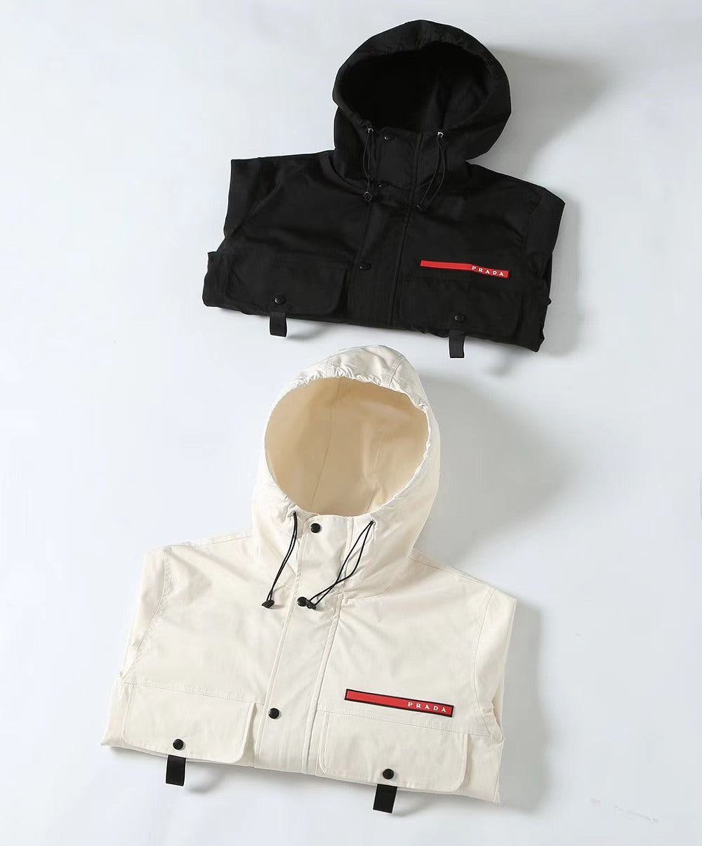 Prada long hooded jackets, black and white, with drawstring hoods and button fronts
