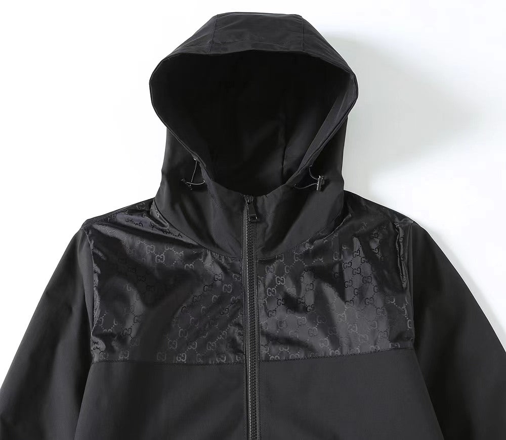 Gucci black hooded jacket with front zipper and GG-pattern chest panel