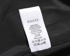 Gucci interior care label with Made in Italy text on dark fabric