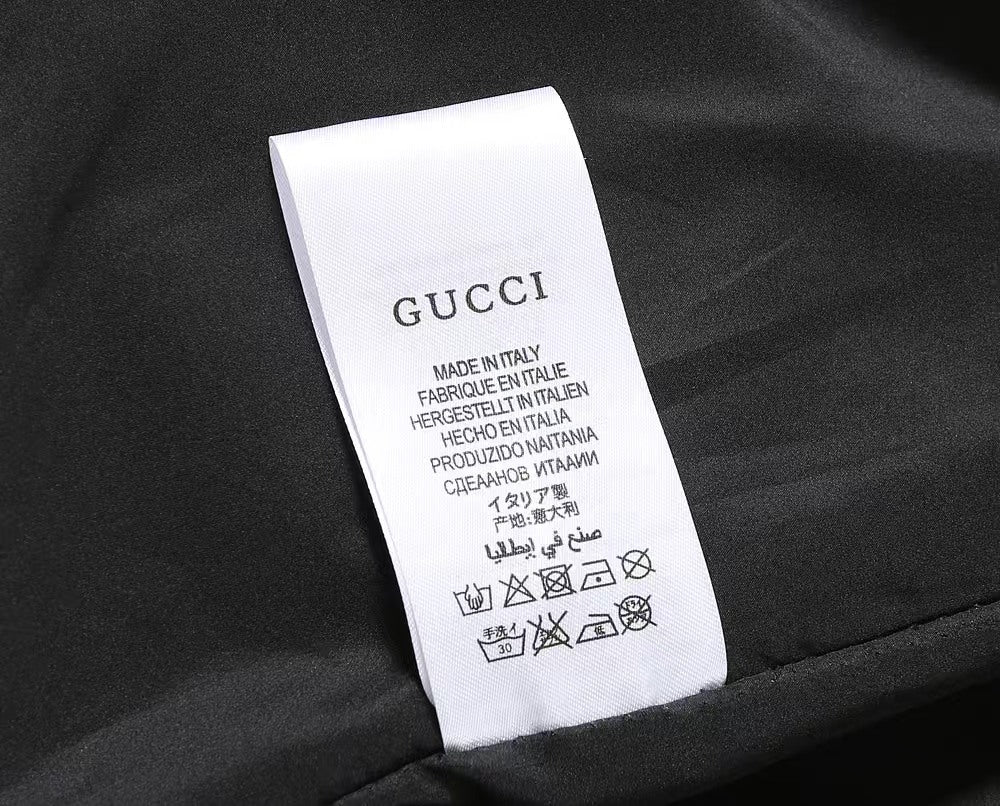 Gucci black jacket care label reading Made in Italy and symbols