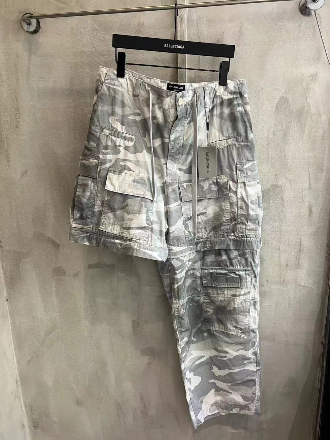 Balenciaga camouflage cargo pants, light gray and white, full front view with cargo pockets