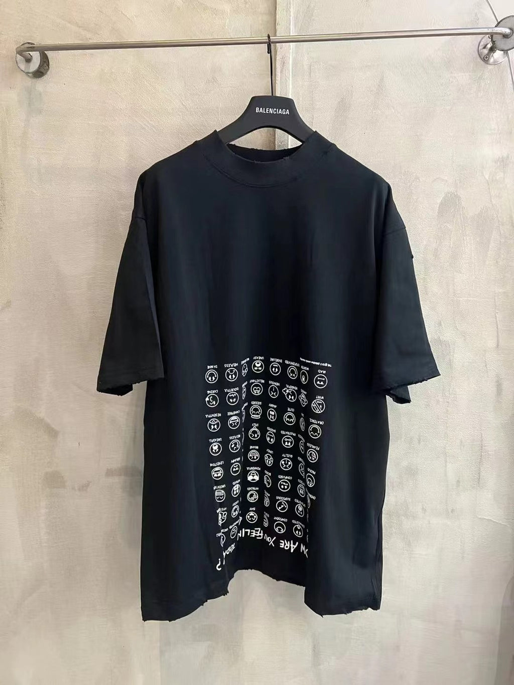 Black crew-neck T-shirt with short sleeves and large logo-style icon graphic print