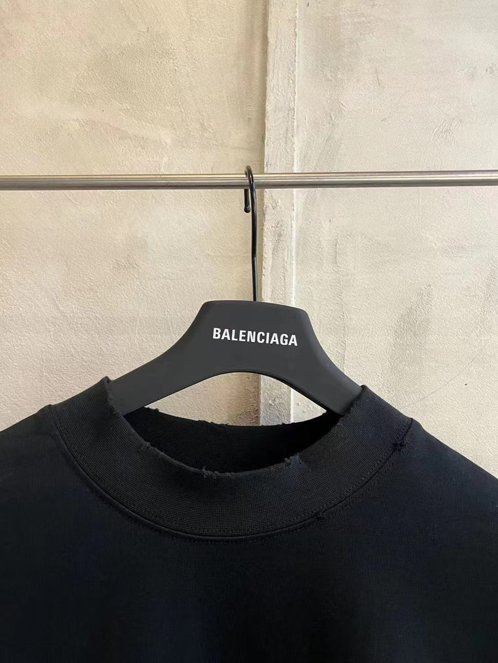 Black short-sleeve T-shirt crew neck with Balenciaga label on hanger