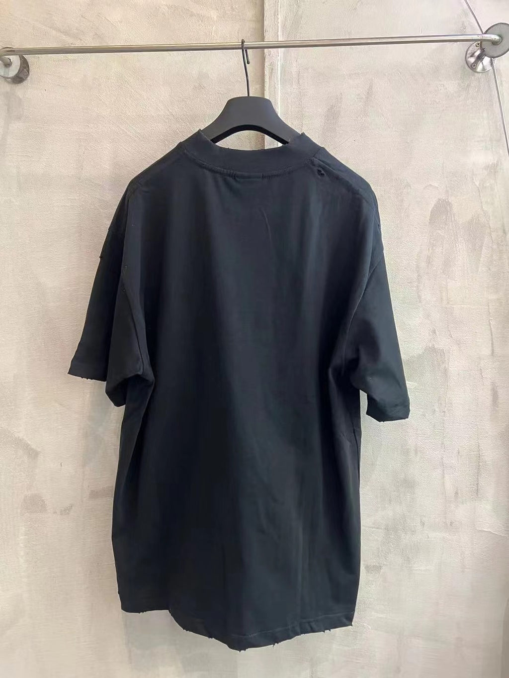 Black crew-neck T-shirt with short sleeves and plain back view