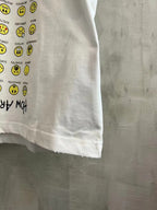 Balenciaga short-sleeve T-shirt, white, lower front close-up with yellow smiley print