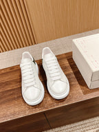 Alexander McQueen leather sneakers, white with lace-up front and smooth side panels