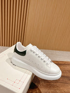 Alexander McQueen leather sneakers, white with green collar and lace-up design
